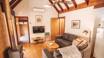 Couples Cottage + Extra Room (Air Con in Living Room) | Living area | TV, DVD player