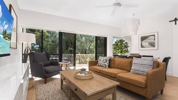 3 Bedroom Premium Mid-level Apartment | Living area | Flat-screen TV, DVD player