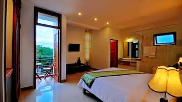 Deluxe Room, Balcony | Minibar, in-room safe, desk, laptop workspace