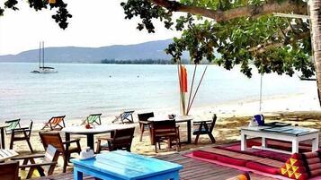 On the beach, sun-loungers, beach umbrellas, beach towels