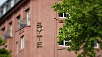 A building with the name 'SYTE' prominently displayed on its facade.