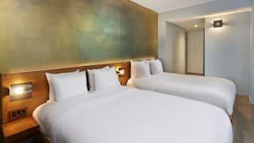 Premium bedding, in-room safe, laptop workspace, soundproofing