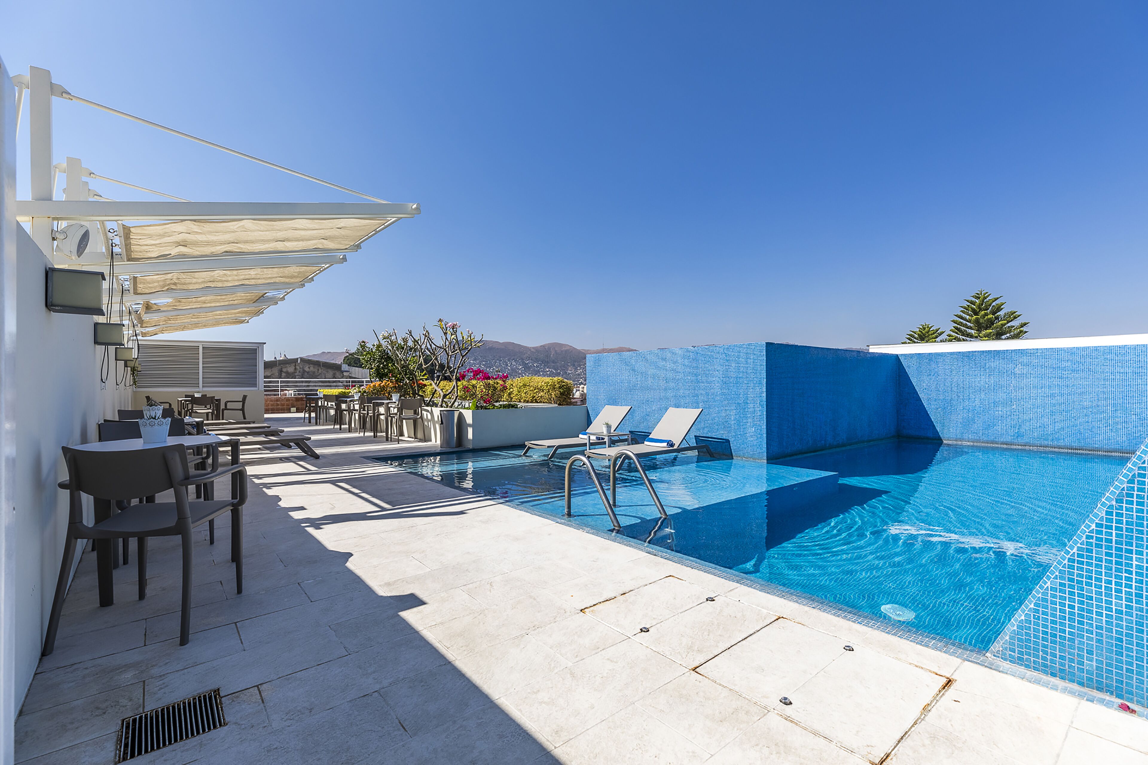 outdoor pool, pool umbrellas, pool loungers