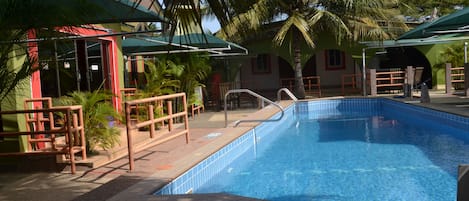 Outdoor pool, pool umbrellas, sun loungers