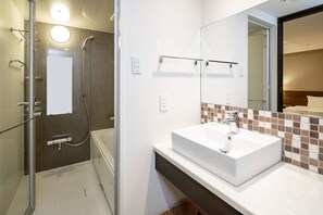 Free toiletries, hair dryer, slippers, electronic bidet