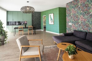 Atlantic View Deluxe Suite | Living room | 55-inch Smart TV with digital channels, Netflix, Hulu - Sovn Experience+Lifestyle (Cape Town)