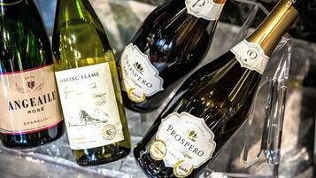 A selection of wine bottles in a chilled display.