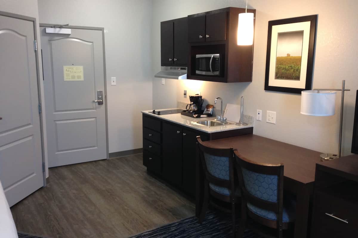 full-sized fridge, microwave, stovetop, coffee/tea maker