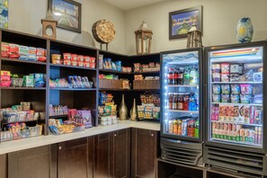 A well-stocked convenience store with shelves of snacks, beverages, and packaged goods. - Holiday Inn Express & Suites Edwardsville by IHG (Edwardsville)