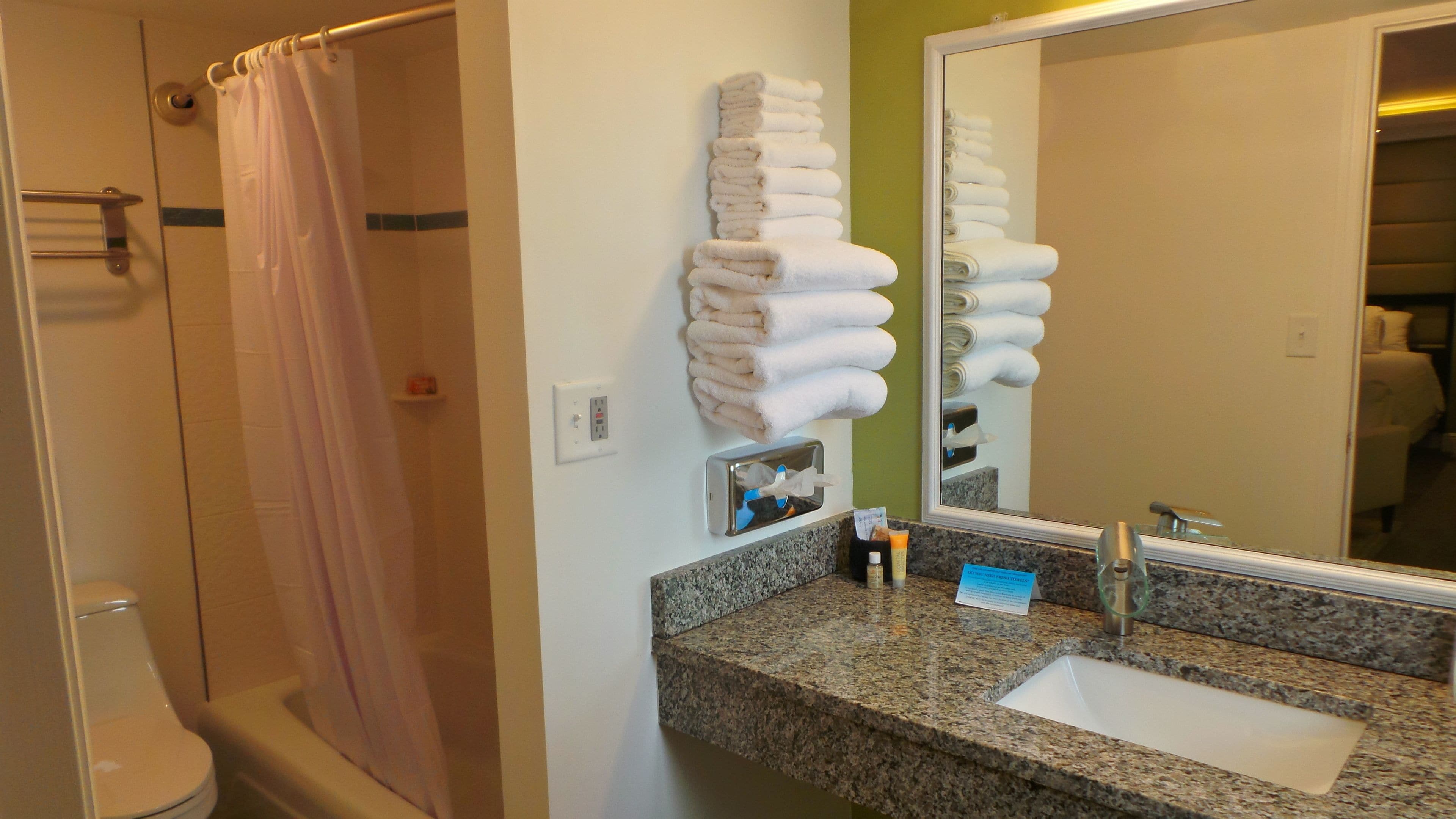 deluxe room, 1 king bed | bathroom | combined shower/bathtub, hair dryer, towels