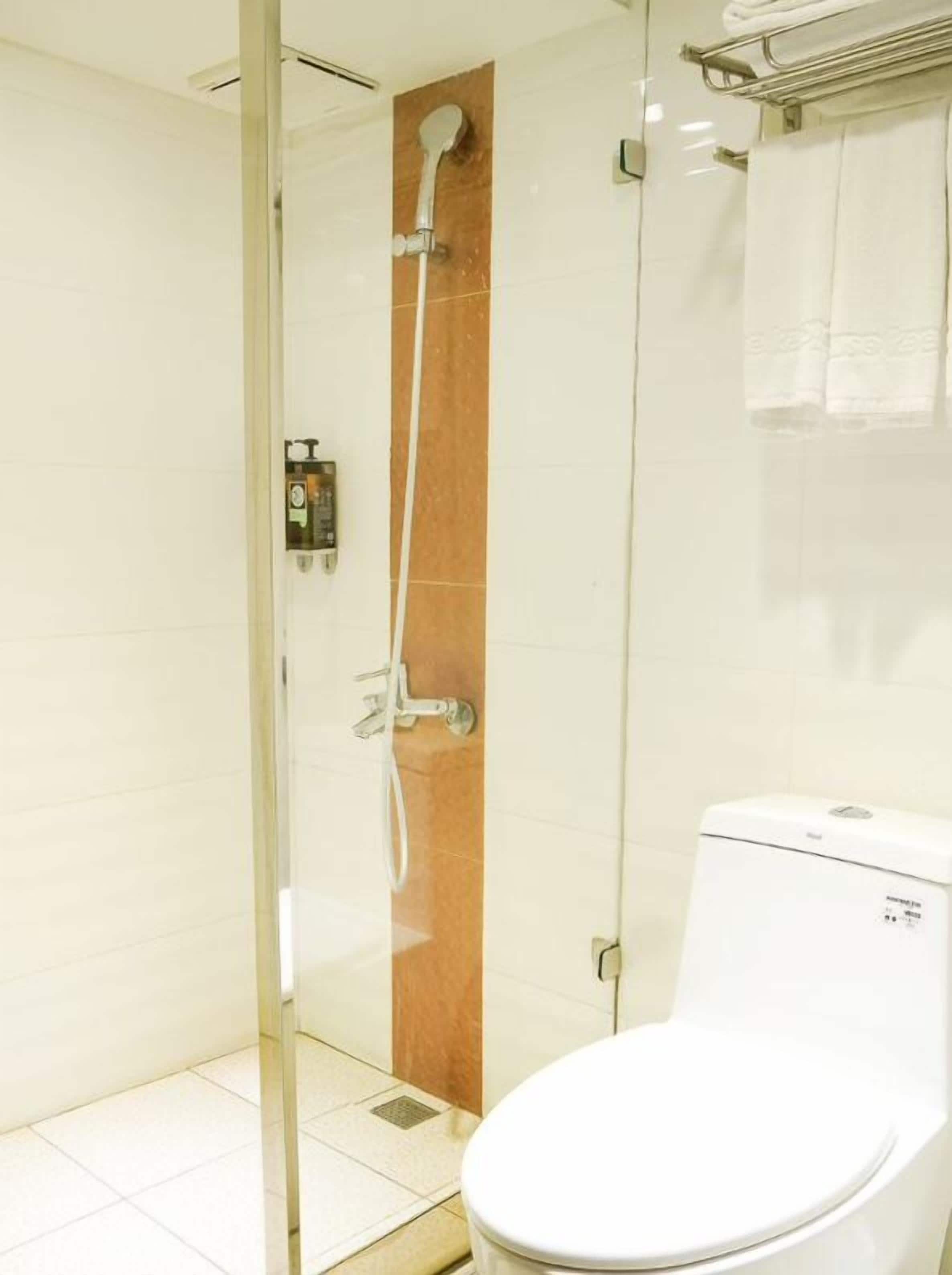 economy quadruple room, no windows | bathroom | shower, hair dryer, towels