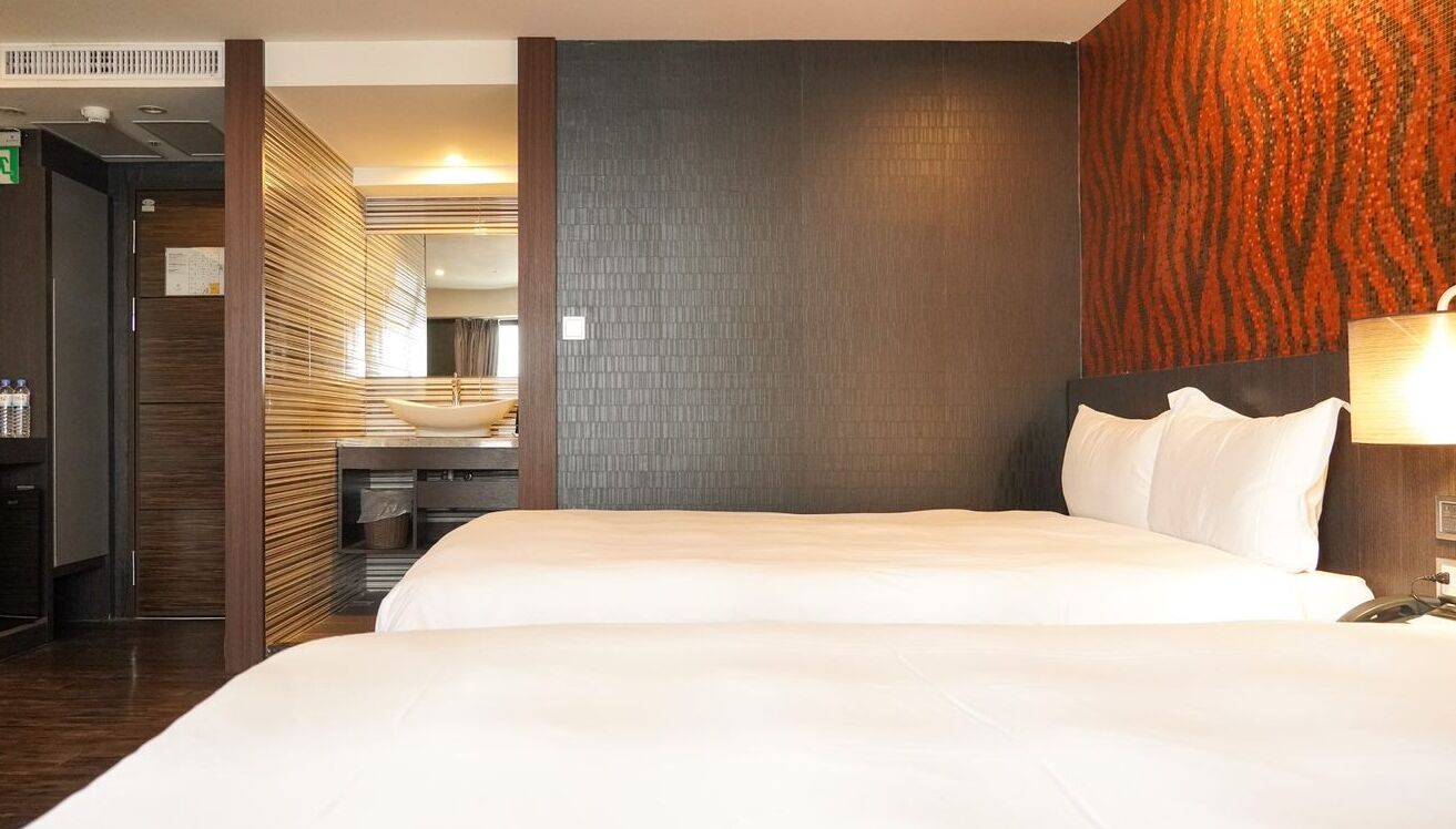 standard quadruple room, city view | down duvets, free minibar, individually decorated