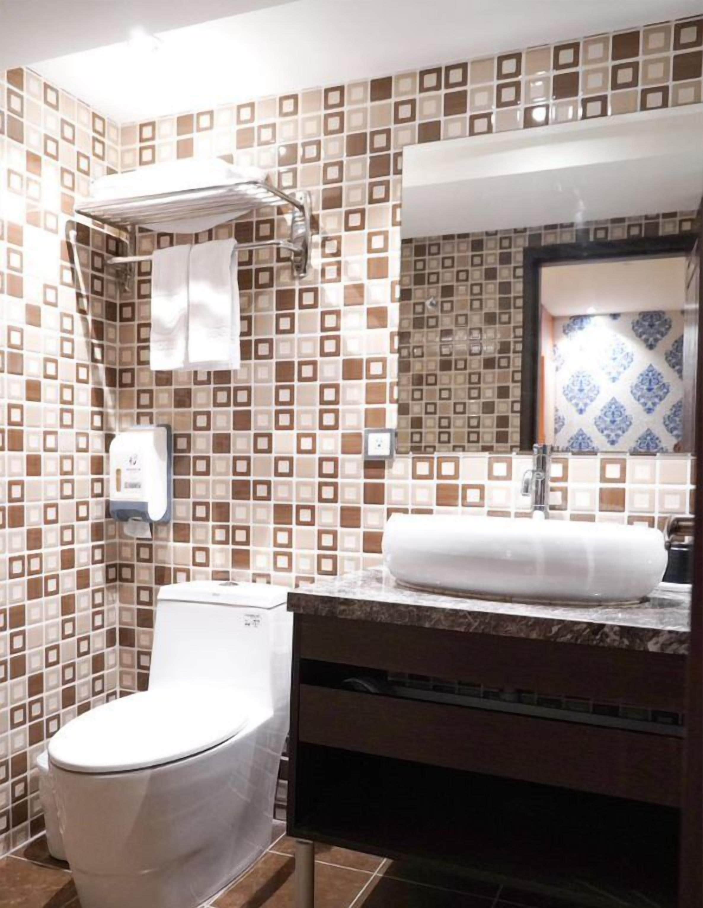 economy twin room, no windows | bathroom | shower, hair dryer, towels