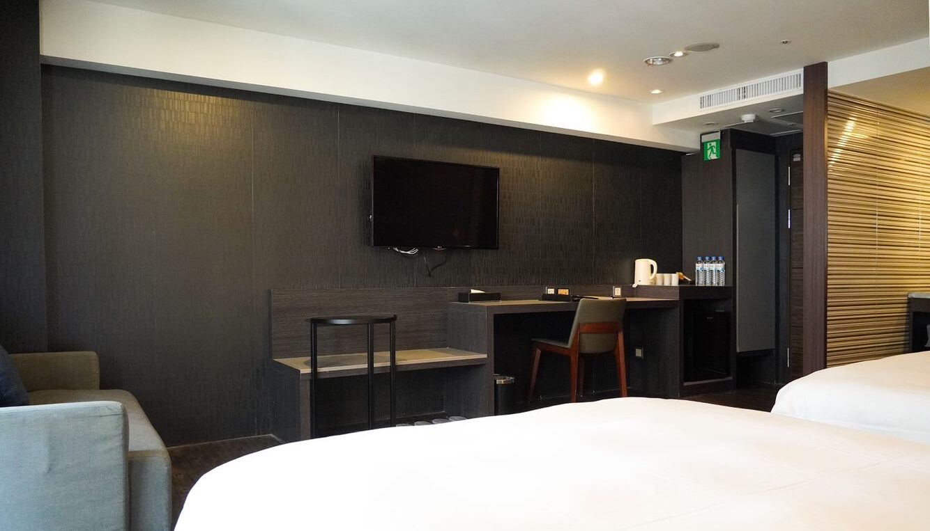 standard quadruple room, city view | down duvets, free minibar, individually decorated