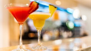 Two cocktails on a bar counter with a blurred background. - International Hotel Wagga Wagga (East Wagga Wagga)