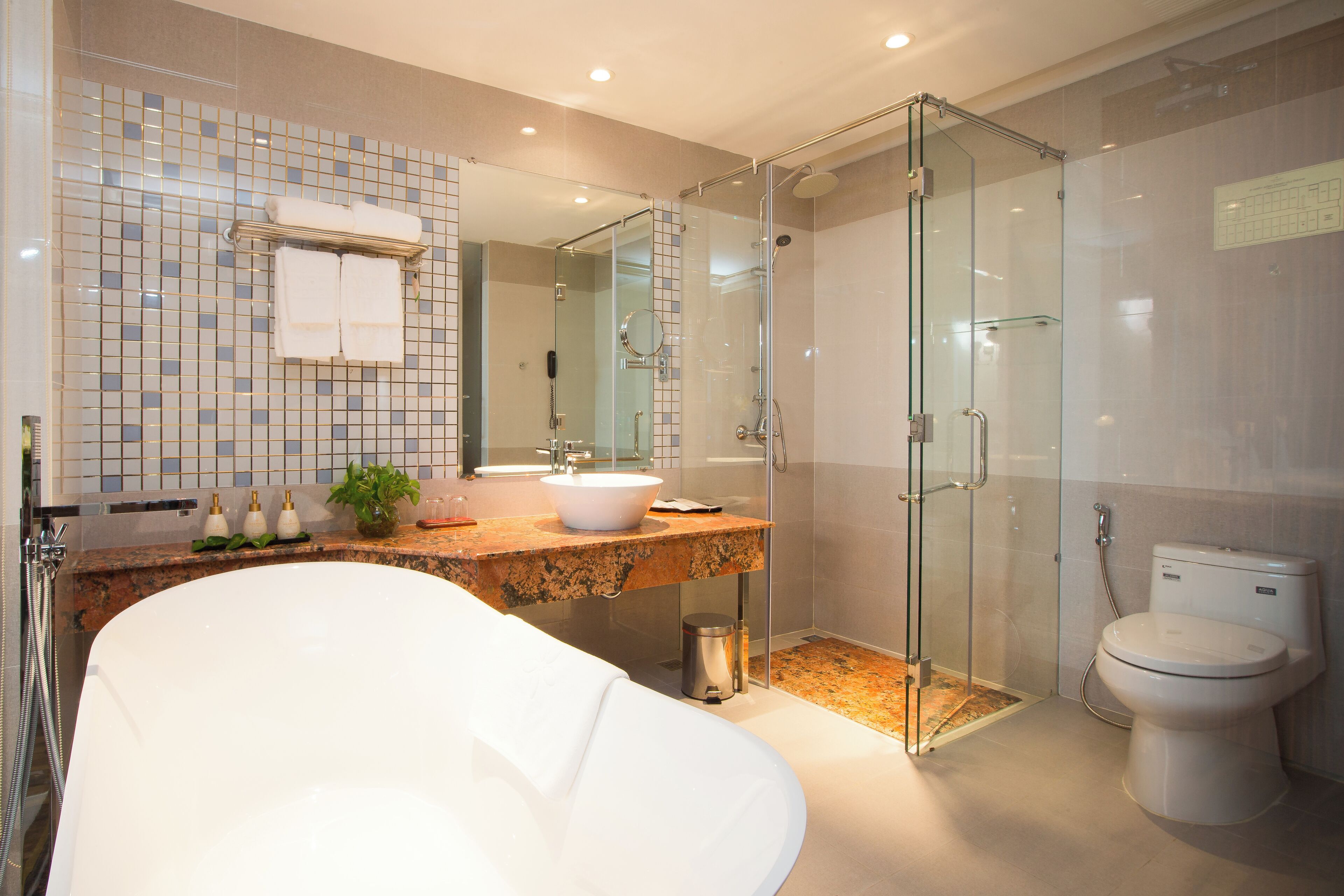 junior suite | bathroom | designer toiletries, hair dryer, bathrobes, slippers