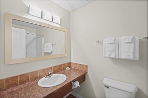 Combined shower/bathtub, hair dryer, towels, soap