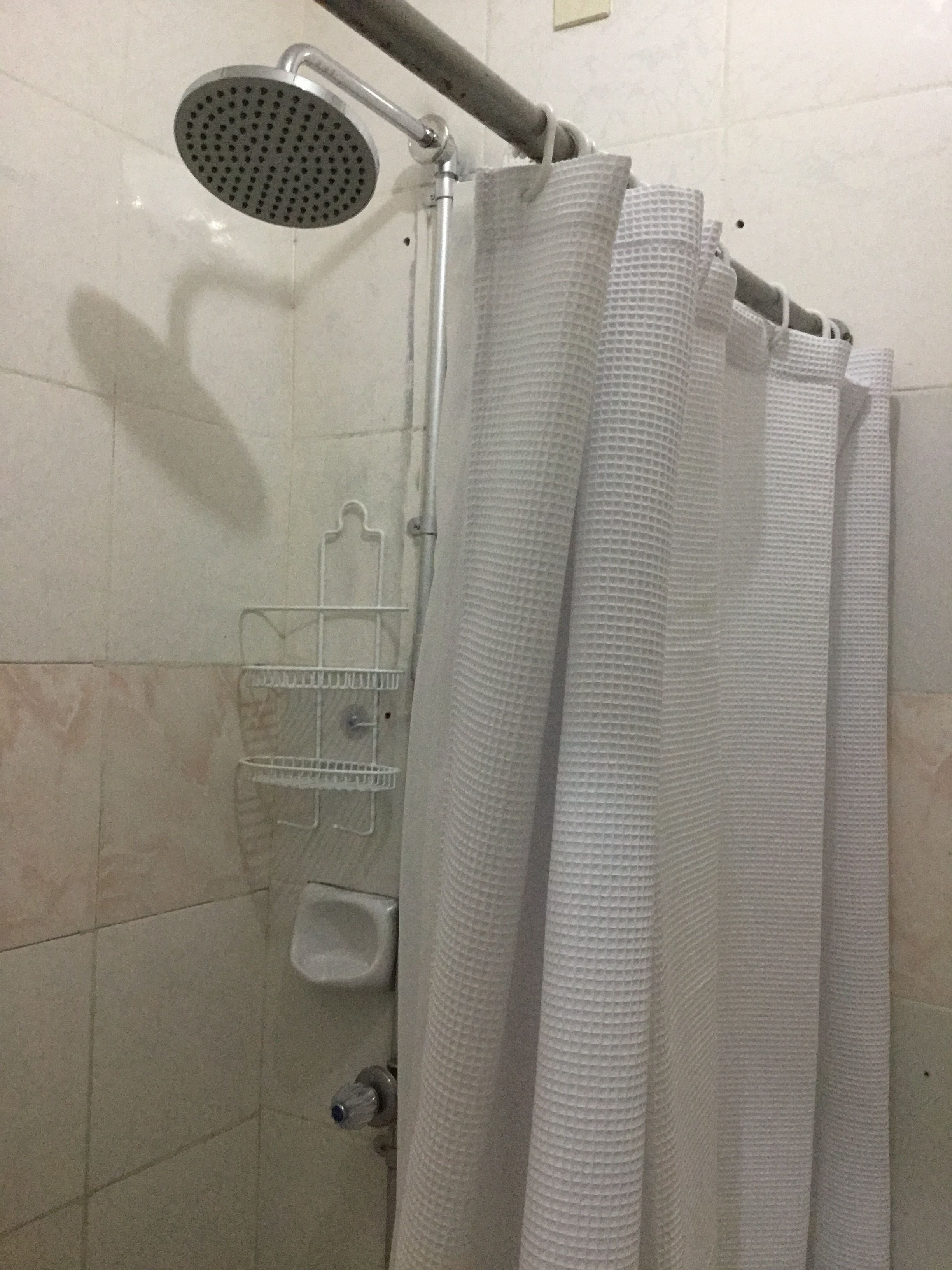 deluxe quad with balcony serene | bathroom | shower, hair dryer, towels