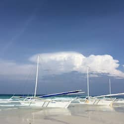 Beach nearby, white sand, beach towels