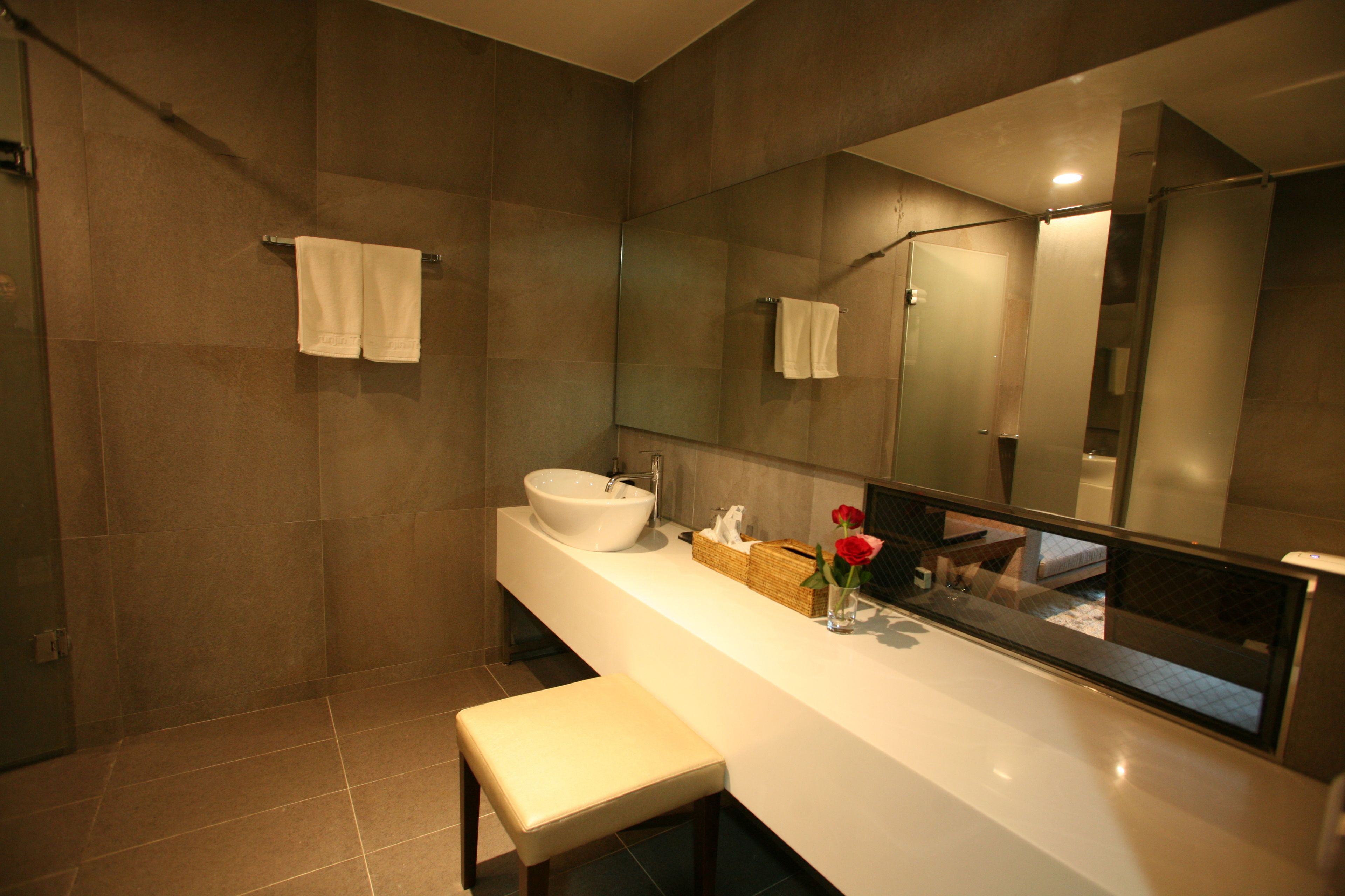junior suite | bathroom | shower, hair dryer, bathrobes, slippers