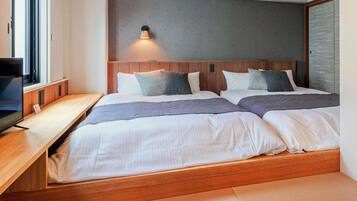 Escritorio, sistema de insonorización, wifi gratis y ropa de cama