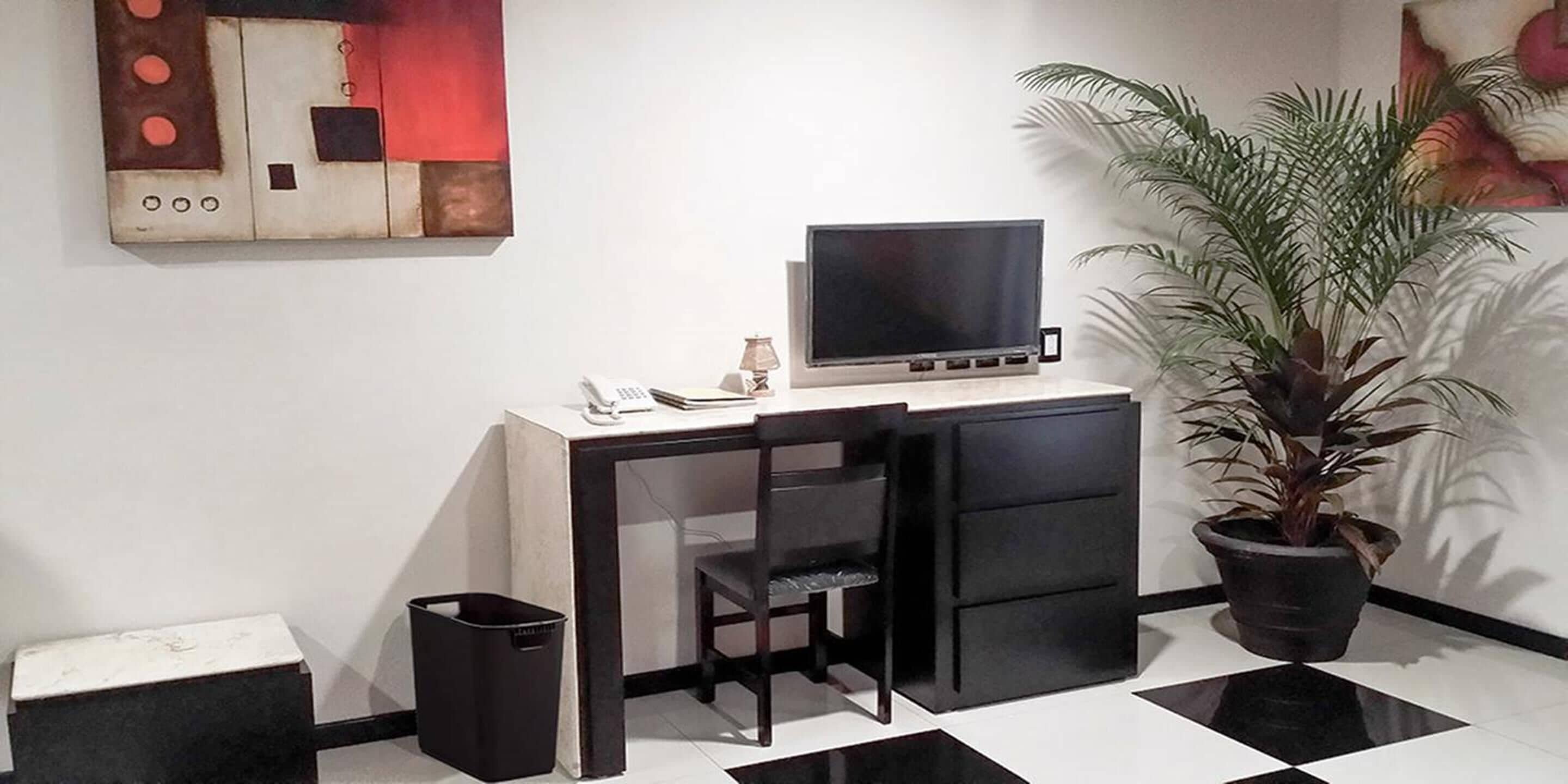 family room | in-room safe, desk, laptop workspace, iron/ironing board