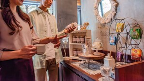 A cafe with a wooden counter, jars of condiments, and a decorative mirror. - Hotel Relief Sapporo Susukino (Sapporo)