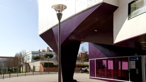 A modern building with a unique architectural design, featuring a prominent overhang and a clear sky in the background. - Séjours & Affaires Massy Atlantis (Massy)