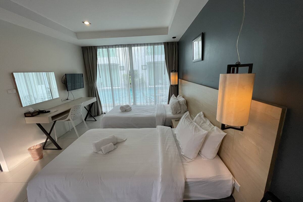 twin room, pool access | in-room safe, blackout curtains, iron/ironing board, rollaway beds