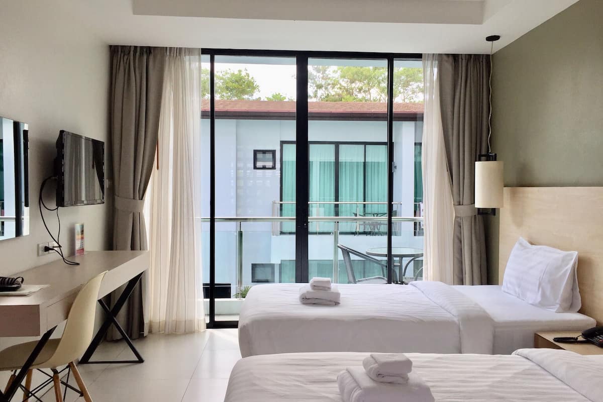 twin room, pool view | in-room safe, blackout curtains, iron/ironing board, rollaway beds