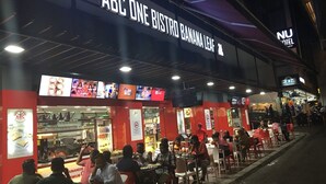 A restaurant named ABC ONE BISTRO BANANA LEAF with outdoor seating and a visible menu board. - My Hotel @ Sentral (Kuala Lumpur)