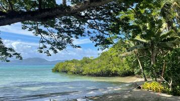On the beach, sun-loungers, beach towels, scuba diving