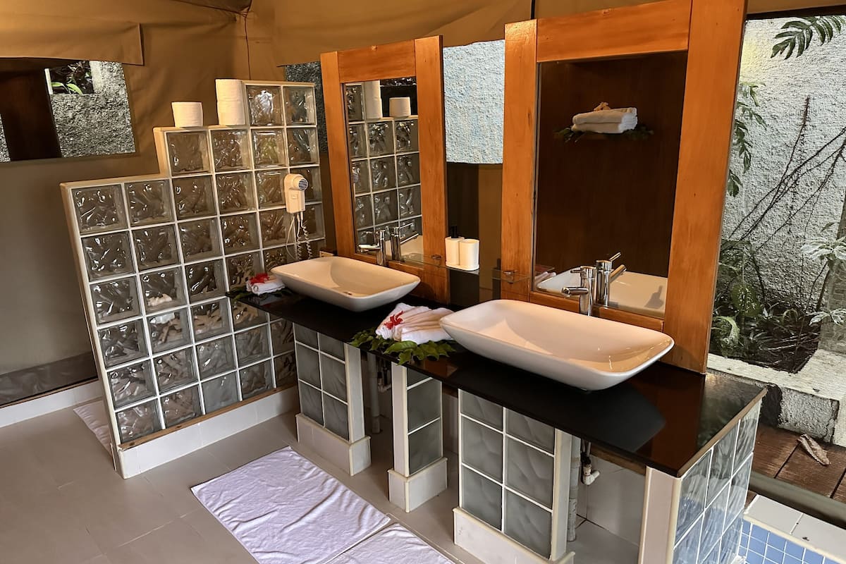 luxury african safari tent | 1 bedroom, premium bedding, pillow-top beds, minibar