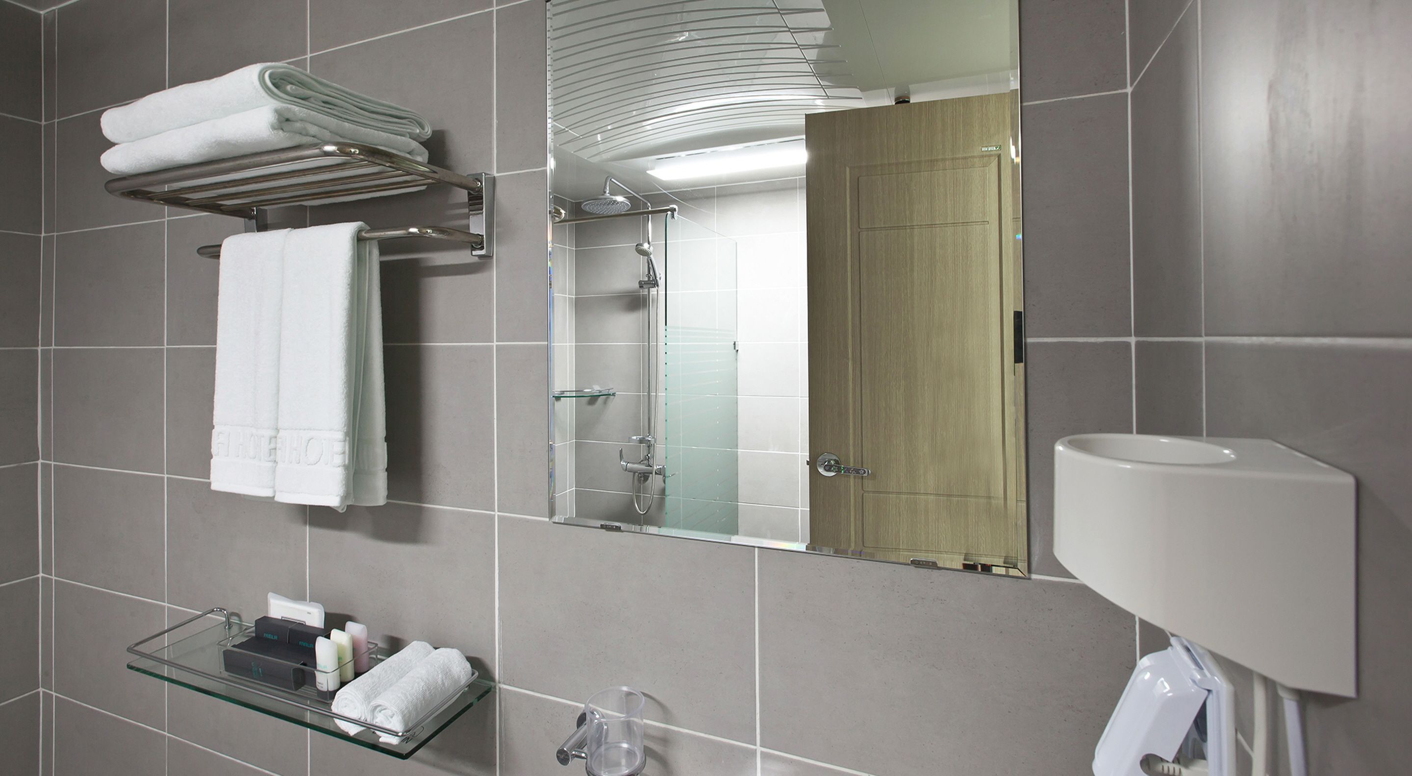 rainfall showerhead, designer toiletries, hair dryer, slippers