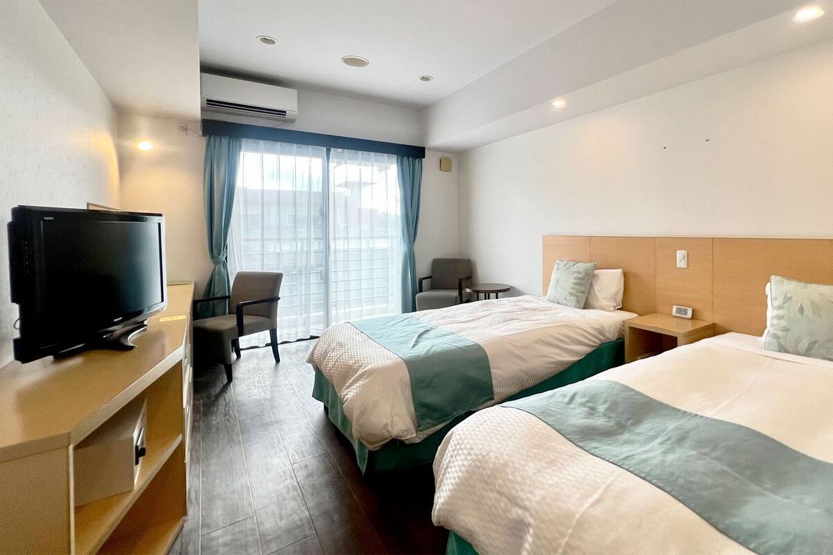 Premium bedding, down duvets, in-room safe, desk