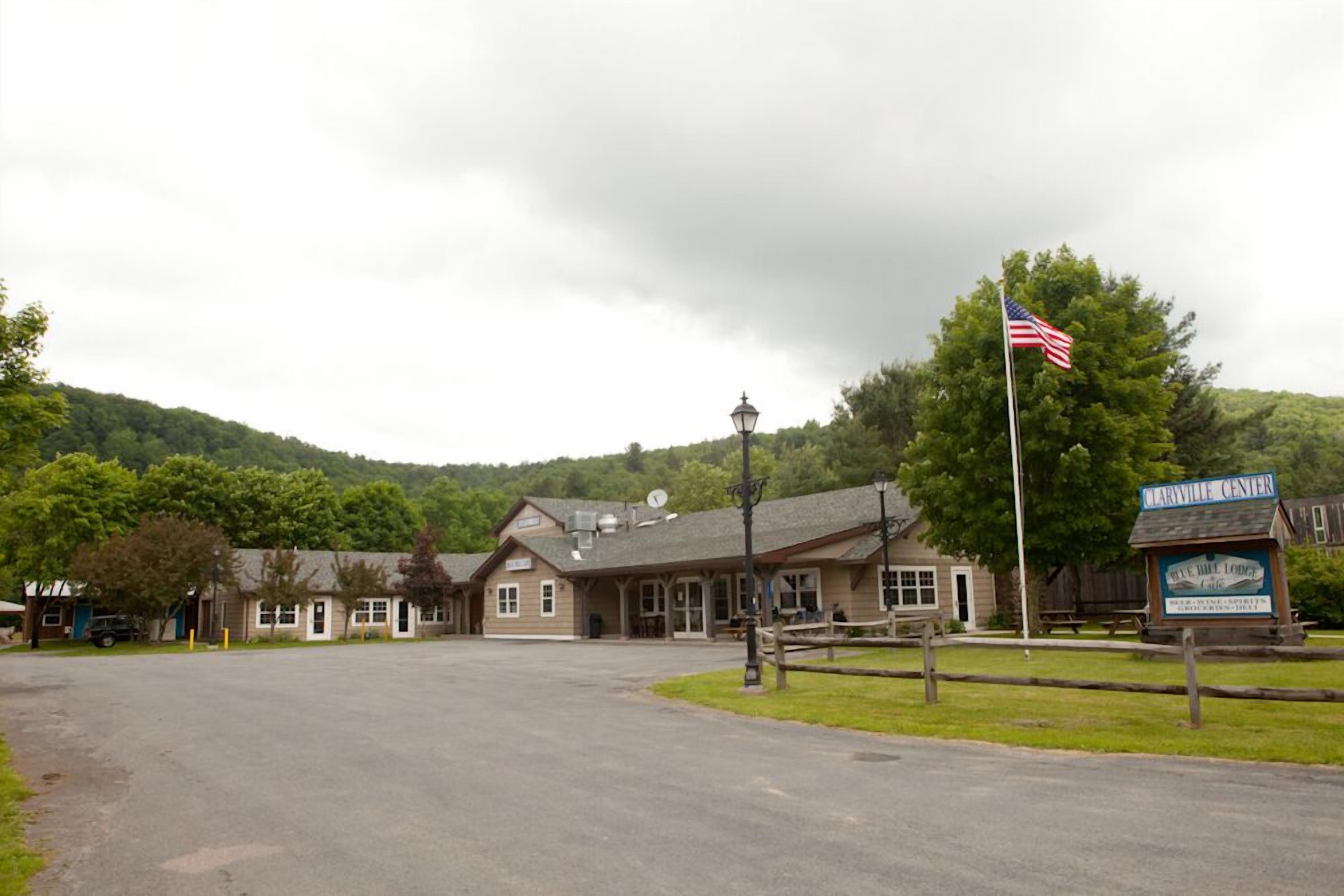 A building with a sign reading "Clarville Center" and an American flag.