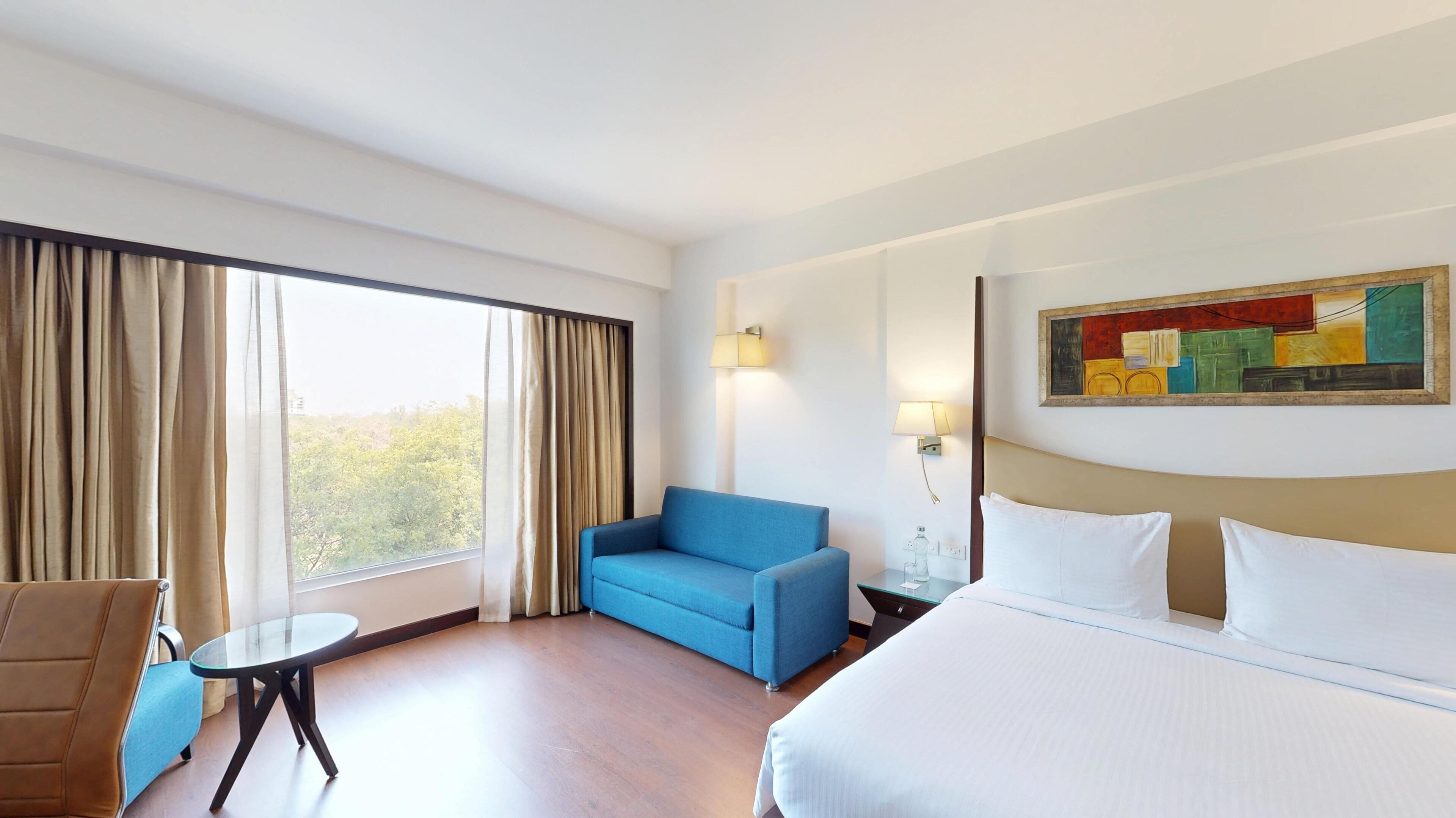 Deluxe Room | Down comforters, memory foam beds, minibar, in-room safe