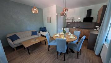 Basic Suite, 2 Bedrooms | Living area | LCD TV