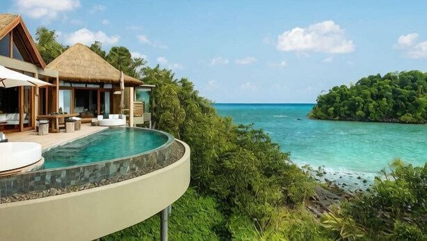 A resort with a private infinity pool, a thatched-roof structure, and a view of the ocean and a small island. - SONG SAA PRIVATE ISLAND (Koh Ouen)