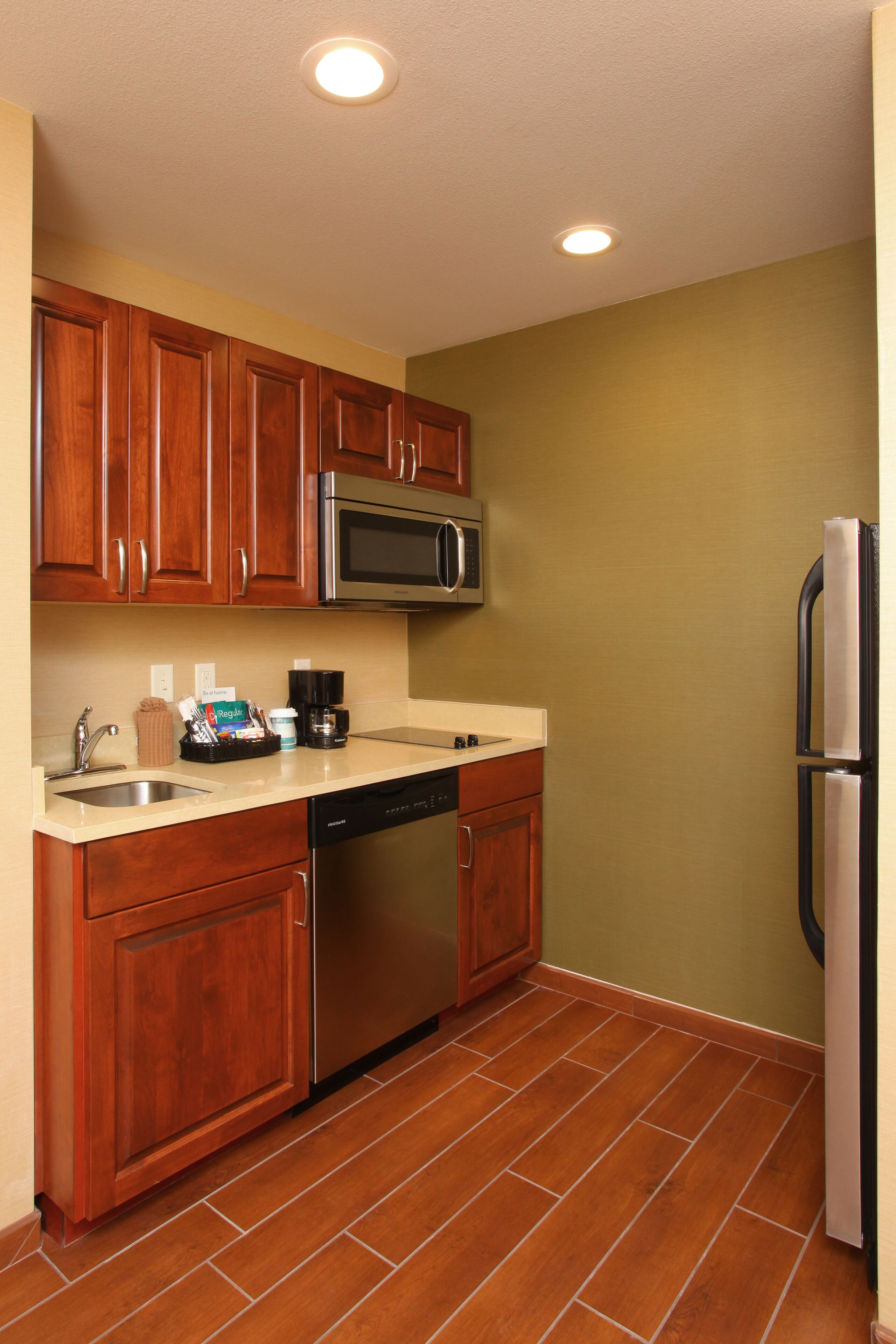 full-sized fridge, microwave, stovetop, dishwasher