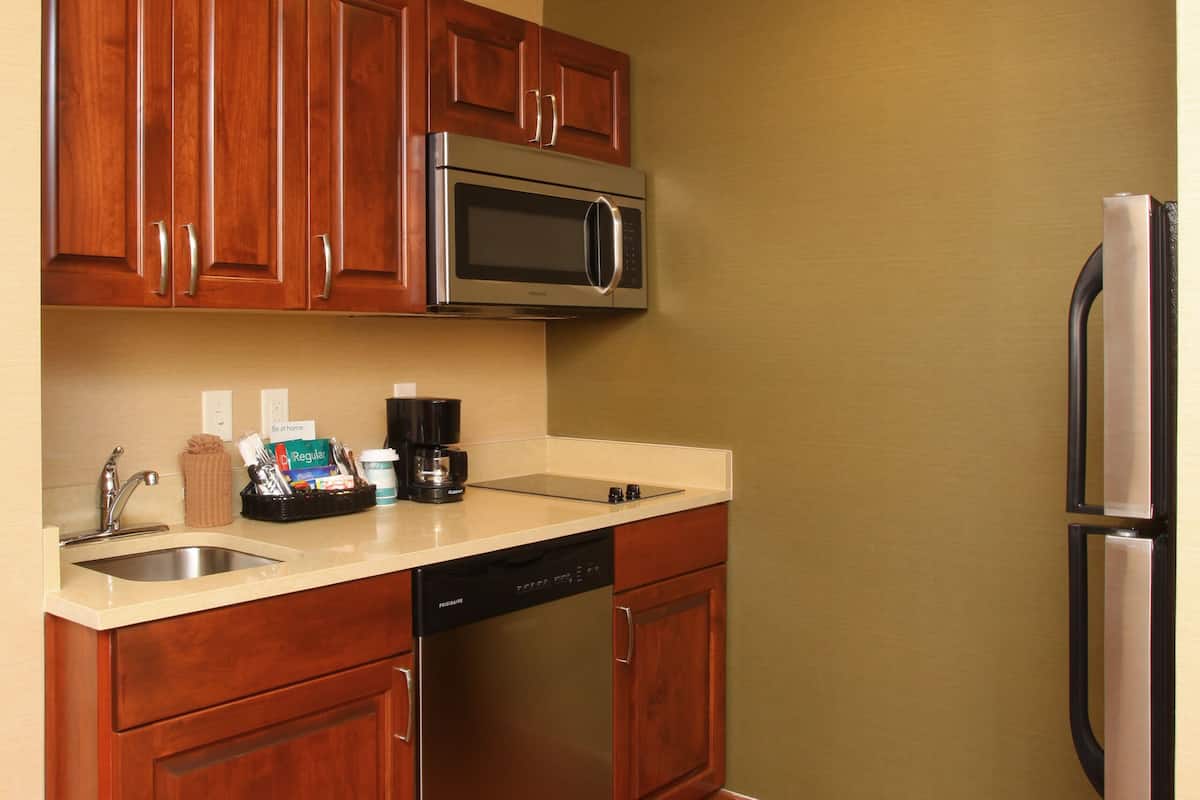 full-sized fridge, microwave, stovetop, dishwasher