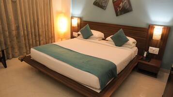 Habitación superior | Ropa de cama de alta calidad y minibar