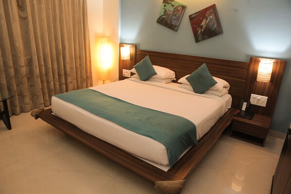 Habitación superior | Ropa de cama de alta calidad y minibar