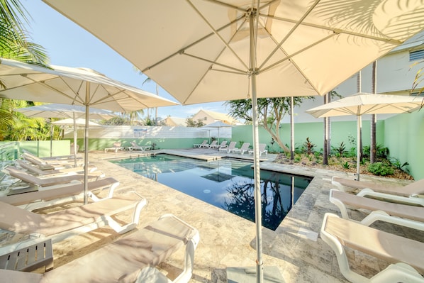 Outdoor pool, a heated pool, open 7:00 AM to 7:30 PM, pool umbrellas