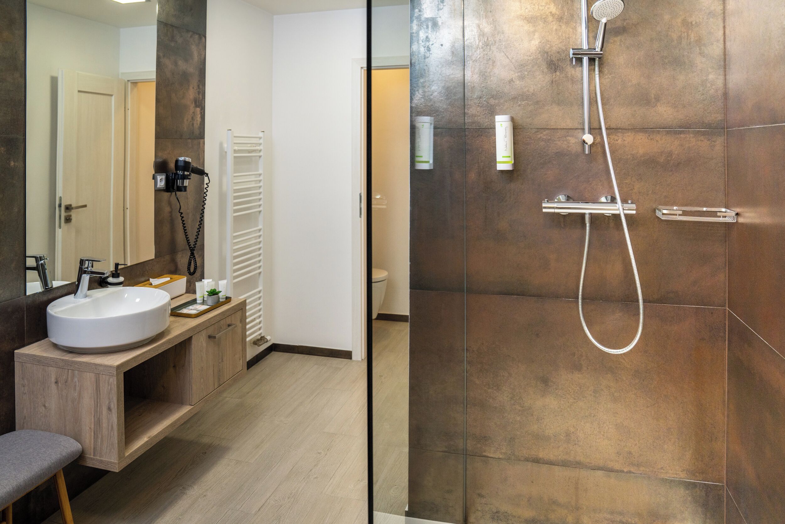 double deluxe studio | bathroom | shower, free toiletries, hair dryer, towels