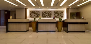 Welcome to our reception area, featuring three reception desks and a stylish, modern design.
