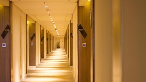 A hotel corridor with doors numbered 1206 and 1205. - Hotel Benilde Maison De La Salle (Manila)
