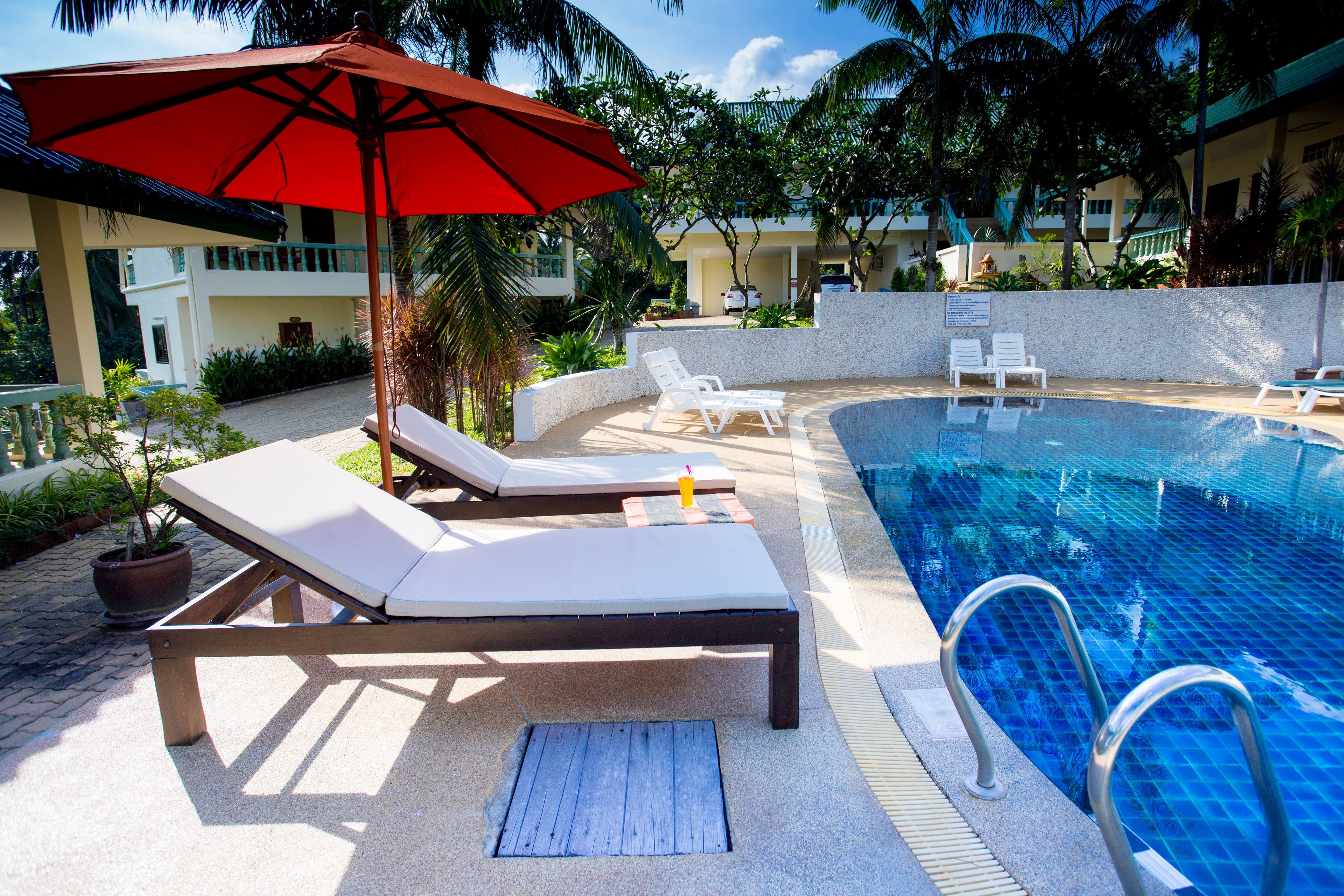 outdoor pool, pool umbrellas, pool loungers