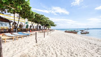 On the beach, white sand, beach shuttle, sun loungers