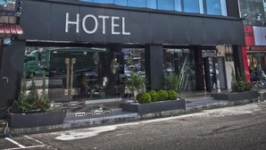 The exterior of the Euro Hotel with a modern glass facade and a prominent sign.